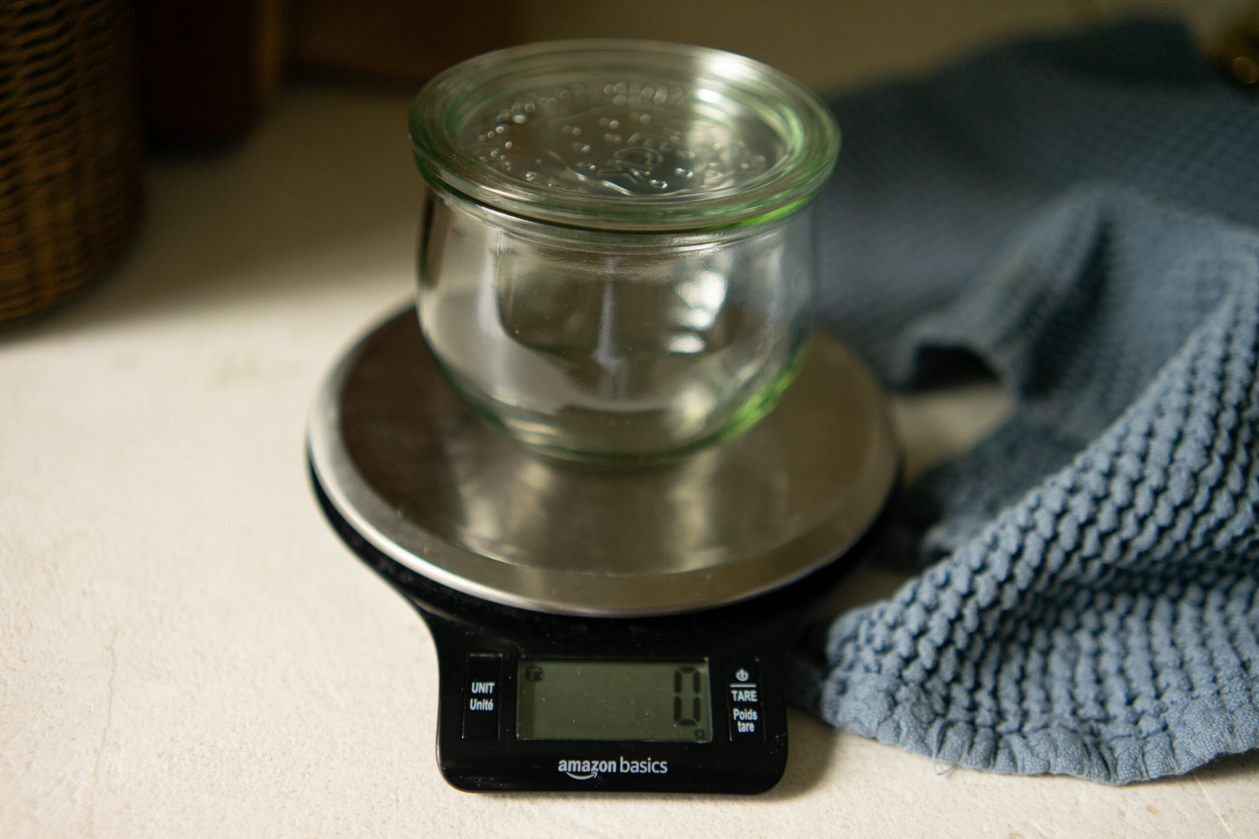 sourdough bread on kitchen scale with tutorial on measuring in a DIY modern traditional pantry